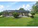 Screened-in patio with a pool overlooking a lush green backyard, great for outdoor living at 6730 Sw 9Th Ave, Ocala, FL 34476