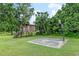 Backyard featuring a wooden playhouse and basketball court at 6730 Sw 9Th Ave, Ocala, FL 34476