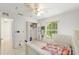 Bedroom with a window, open closet, ceiling fan and bed at 6730 Sw 9Th Ave, Ocala, FL 34476