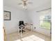 Bright bedroom with tile flooring and a large window offering views of the outdoors at 6730 Sw 9Th Ave, Ocala, FL 34476