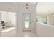 Inviting entryway features tiled floors, a decorative front door, and access to adjacent rooms and living spaces at 6730 Sw 9Th Ave, Ocala, FL 34476