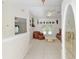 Bright foyer featuring tile flooring, neutral walls, and views into the living area, creating a welcoming entry at 6730 Sw 9Th Ave, Ocala, FL 34476
