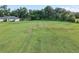 Expansive front yard with mature trees and landscaping, providing a serene and private setting for the home at 6730 Sw 9Th Ave, Ocala, FL 34476