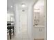 Hallway with an open view of a bathroom on the right and kitchen on the left at 6730 Sw 9Th Ave, Ocala, FL 34476