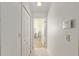 Hallway leading to the kitchen and bedrooms, providing seamless flow throughout the home at 6730 Sw 9Th Ave, Ocala, FL 34476