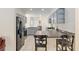 Modern kitchen with stainless steel appliances, gray cabinetry, and barstool seating at 6730 Sw 9Th Ave, Ocala, FL 34476