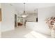 Open-concept living area features tile flooring, neutral paint, and lots of natural light at 6730 Sw 9Th Ave, Ocala, FL 34476