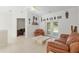 Bright and airy living room with tile floors and neutral decor, creating a comfortable and inviting atmosphere at 6730 Sw 9Th Ave, Ocala, FL 34476