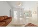 Bright and spacious living room featuring tile flooring and neutral walls, providing an inviting atmosphere for gatherings at 6730 Sw 9Th Ave, Ocala, FL 34476