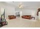 Open living space with tile floors, neutral paint, and seamless flow into the kitchen at 6730 Sw 9Th Ave, Ocala, FL 34476