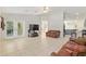 Spacious living room features tile floors, ceiling fan, and an open layout at 6730 Sw 9Th Ave, Ocala, FL 34476