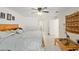 Spacious main bedroom featuring tile flooring, ceiling fan, and multiple closets at 6730 Sw 9Th Ave, Ocala, FL 34476