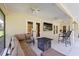 Comfortable covered patio featuring a cozy seating area with a TV and fire pit at 6730 Sw 9Th Ave, Ocala, FL 34476