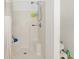 Shower stall with white walls and a curtain; a toilet is next to the shower at 6730 Sw 9Th Ave, Ocala, FL 34476