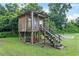 Exterior view of treehouse featuring stairs, a porch and basketball court at 6730 Sw 9Th Ave, Ocala, FL 34476