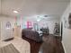 Inviting living room with ample seating, hardwood floors, and natural light, perfect for relaxation at 6814 Se 53Rd Pl, Ocala, FL 34472
