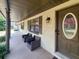 Inviting front porch with comfortable seating, creating a welcoming entrance to the home at 6814 Se 53Rd Pl, Ocala, FL 34472