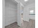Walk-in closet with built-in wire shelving and wood-look flooring at 7 Dogwood Trail Run, Ocala, FL 34472