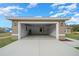 Spacious two-car garage with concrete floor, interior light, and visible water heater at 7 Dogwood Trail Run, Ocala, FL 34472
