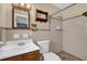 This bathroom features a walk-in shower, a sink and a toilet at 713 Se 34Th Ter, Ocala, FL 34471