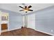 This bedroom has hardwood floors, light blue walls and two closets at 713 Se 34Th Ter, Ocala, FL 34471