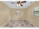 This bedroom features tile floors, neutral walls and a ceiling fan at 713 Se 34Th Ter, Ocala, FL 34471