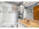 Well-lit bathroom features tile floor, shower-tub combo, vanity with sink, and mirror at 7443 Sw 102Nd Pl, Ocala, FL 34476