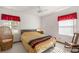 Serene bedroom with a comfortable bed, natural light, and neutral decor, creating a peaceful atmosphere at 7443 Sw 102Nd Pl, Ocala, FL 34476