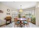 Cozy dining area with a round wooden table and natural light at 7443 Sw 102Nd Pl, Ocala, FL 34476