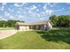 Well-maintained home with lush green lawn and mature landscaping at 7443 Sw 102Nd Pl, Ocala, FL 34476