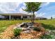 The home's backyard features a rock water feature, landscaping, and a view of the property at 9746 Sw 108Th Terrace Rd, Ocala, FL 34481