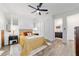 Bedroom featuring ceiling fan, en suite bath, and sliding door closet at 9746 Sw 108Th Terrace Rd, Ocala, FL 34481
