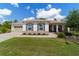 Inviting one-story home boasting manicured landscaping, beautiful stone accents, and a two-car garage at 9746 Sw 108Th Terrace Rd, Ocala, FL 34481