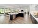 This expansive kitchen has stainless appliances, dark lowers, and a large island at 9746 Sw 108Th Terrace Rd, Ocala, FL 34481