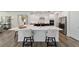 Modern kitchen with stainless appliances, a center island with seating, and white countertops at 9746 Sw 108Th Terrace Rd, Ocala, FL 34481