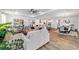 Expansive living area with open-concept design seamlessly connecting the living room, dining, and kitchen areas at 9746 Sw 108Th Terrace Rd, Ocala, FL 34481