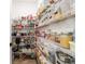 Walk-in pantry with ample shelving, providing lots of storage space for food and supplies at 9746 Sw 108Th Terrace Rd, Ocala, FL 34481