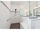 Modern shower featuring white subway tile, mosaic accents and black hardware at 9746 Sw 108Th Terrace Rd, Ocala, FL 34481