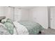 Comfortable bedroom featuring carpet, fresh paint, and a large window for plenty of natural light at 11205 Se 69Th Ter, Belleview, FL 34420