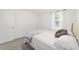 Bedroom featuring neutral colors, carpet flooring, one window, and a bed with a tan headboard at 11205 Se 69Th Ter, Belleview, FL 34420