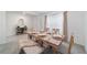 Inviting dining room with a wooden table set for a meal, showcasing a warm and welcoming ambiance at 11205 Se 69Th Ter, Belleview, FL 34420