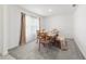 Inviting dining room with a wooden table set for a meal, showcasing a warm and welcoming ambiance at 11205 Se 69Th Ter, Belleview, FL 34420