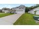 Charming two-story home featuring a well-manicured lawn and an attached two-car garage at 11205 Se 69Th Ter, Belleview, FL 34420