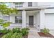 Inviting front entrance featuring a covered porch and well-maintained landscaping at 11205 Se 69Th Ter, Belleview, FL 34420
