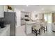 Bright kitchen with granite counters, stainless appliances, and a large central island at 11205 Se 69Th Ter, Belleview, FL 34420