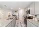 Modern kitchen features granite countertops, stainless steel appliances and gray cabinets at 11205 Se 69Th Ter, Belleview, FL 34420