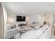 Spacious living room with comfortable seating and a clear view to the staircase at 11205 Se 69Th Ter, Belleview, FL 34420
