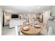Cozy living room with a breakfast nook leading into a living room, stainless steel appliances and granite countertops at 11205 Se 69Th Ter, Belleview, FL 34420