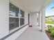 Welcoming front porch with stylish columns and neutral accents at 11205 Se 69Th Ter, Belleview, FL 34420