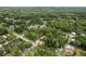 Aerial view of a new home under construction, nestled among mature trees at 11506 Nw 20Th St, Ocala, FL 34482